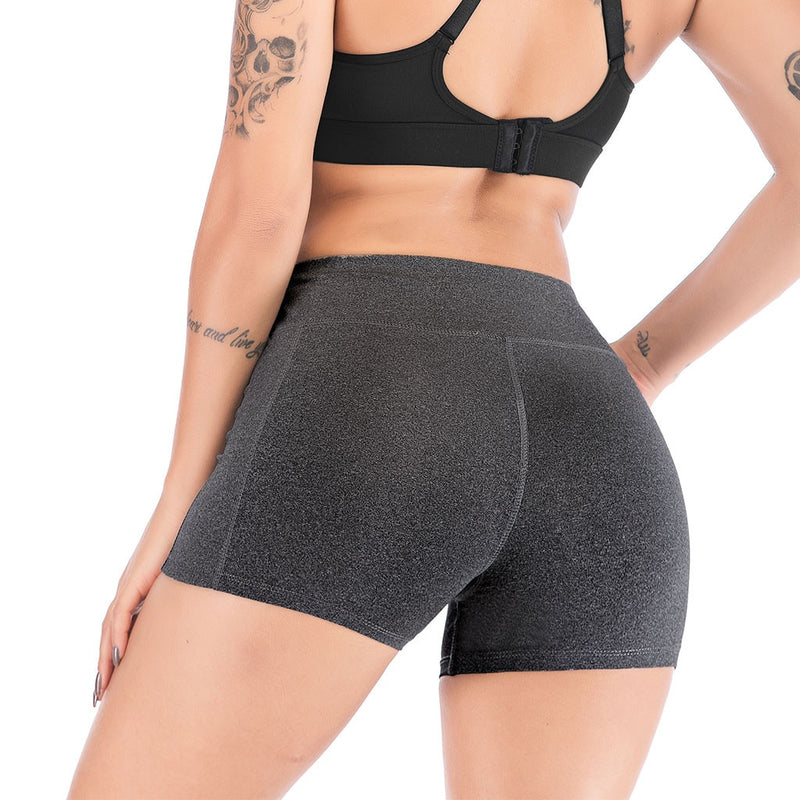 Mujeres Leggings deportivos de fitness Media cintura alta Secado rápido Bolsillo delgado Leggings cortos Mujeres Leggings casuales elásticos.