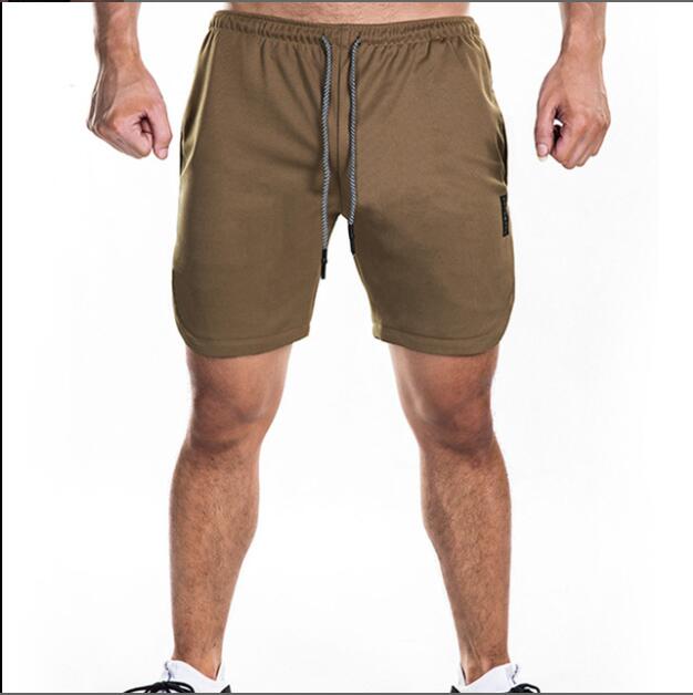 Hombres shorts  de secado rápido fitness , Mens sports quick dry fitness running Gym large size shorts outdoor workout double -deck pants with pockets
